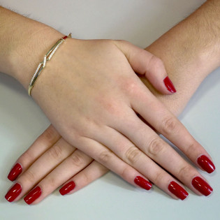 Zlatý náramek bangle X se zirkony | iSezam.cz