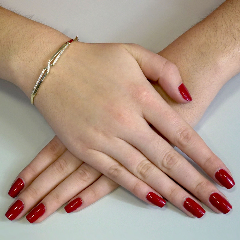 Zlatý náramek bangle X se zirkony PY BLZ0990 ryzost 375