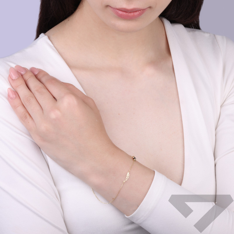 Zlatý náramek filigránové křídlo a černá fazetovaná kulička ryzost 375