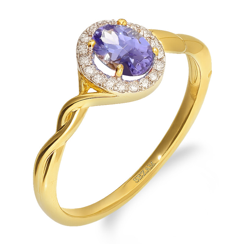 Tento zlatý zásnubní prsten s oválným tanzanitem a třpytivými diamanty je symbolem hluboké lásky. Elegantní design a precizní zp
