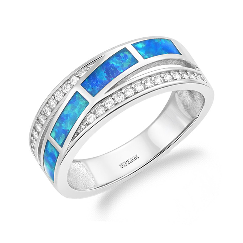Objevte elegantní stříbrný prsten ryzosti 925 se zirkony a modrým syntetickým opálem. Moderní design a třpytivé detaily. Ideální