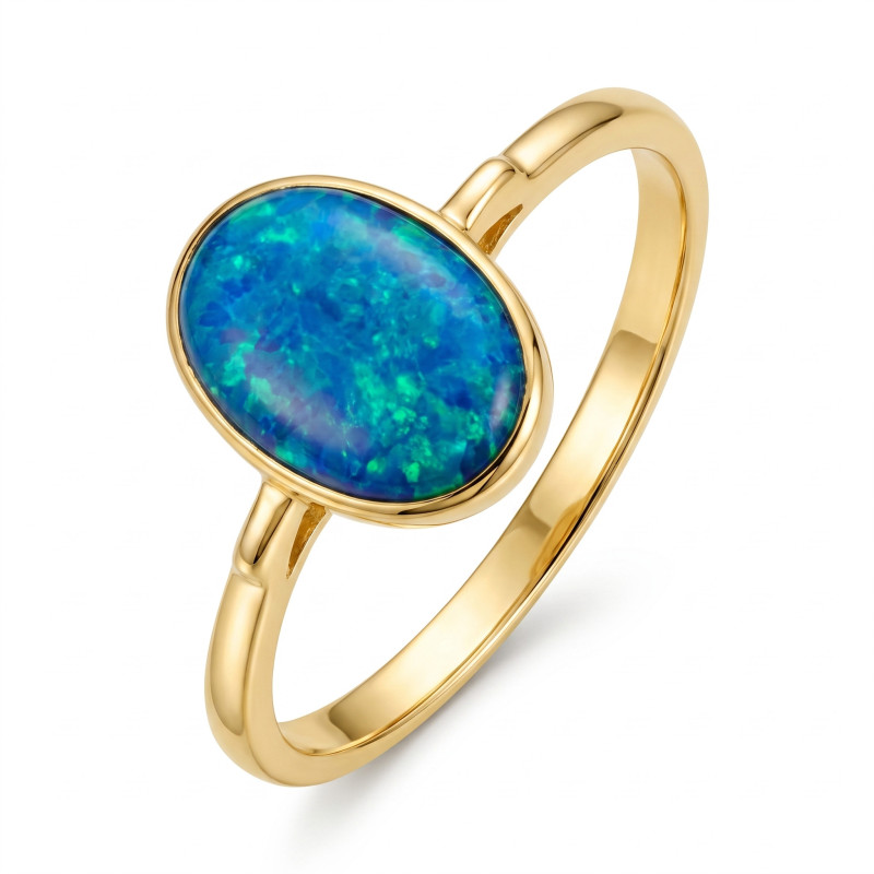 Pierścionek opal niebieski owal 7x5 gł.opraw OS 96-0150 BLU Au 585